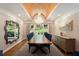 Sophisticated dining room with wood table, chandelier, and backyard views at 7265 Hunters Branch Dr, Sandy Springs, GA 30328