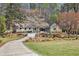 Beautifully landscaped home with a long driveway leading to the front entrance at 7265 Hunters Branch Dr, Sandy Springs, GA 30328