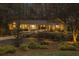 Charming home with stone accents, landscape lighting, and a well-manicured front yard at 7265 Hunters Branch Dr, Sandy Springs, GA 30328