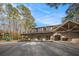 Community clubhouse with a welcoming porch, bright windows, and a play area, ideal for Gathering activities at 7265 Hunters Branch Dr, Sandy Springs, GA 30328