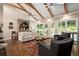 Cozy living room with hardwood floors, fireplace, and French doors to patio at 7265 Hunters Branch Dr, Sandy Springs, GA 30328