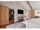 Main bedroom featuring barn doors leading to bathroom and walk-in closet at 7265 Hunters Branch Dr, Sandy Springs, GA 30328