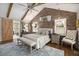 Main bedroom boasts exposed brick wall, ensuite access, and exterior views at 7265 Hunters Branch Dr, Sandy Springs, GA 30328