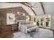 Main bedroom with exposed beams and access to ensuite bathroom at 7265 Hunters Branch Dr, Sandy Springs, GA 30328