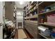Walk-in pantry with custom shelving and ample storage space at 7265 Hunters Branch Dr, Sandy Springs, GA 30328