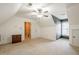 Attic space with carpet flooring, a window, and a closet, offering plenty of room for storage or hobbies at 1765 Dew Pl, Marietta, GA 30064
