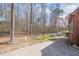 Large backyard with a path leading into the wooded area of the property at 1765 Dew Pl, Marietta, GA 30064