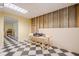 An unfinished basement area with checkerboard tile and a door to another room at 1765 Dew Pl, Marietta, GA 30064