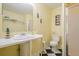 Cozy bathroom features a pedestal sink, black and white tile floor, and walk-in shower at 1765 Dew Pl, Marietta, GA 30064