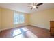 Bedroom featuring wood floors and a large window with natural light at 1765 Dew Pl, Marietta, GA 30064