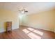 Bright bedroom features hardwood floors, a ceiling fan, and ample space at 1765 Dew Pl, Marietta, GA 30064