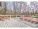 Outdoor deck overlooking wooded backyard featuring modern railing at 1765 Dew Pl, Marietta, GA 30064