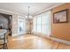 Dining area with hardwood floors, chandelier, view to patio, and ample natural light at 1765 Dew Pl, Marietta, GA 30064
