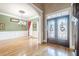 Elegant dining room with hardwood floors, wainscoting, and decorative chandelier at 1765 Dew Pl, Marietta, GA 30064