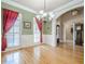 Traditional dining room with hardwood floors, large windows, and a decorative chandelier at 1765 Dew Pl, Marietta, GA 30064