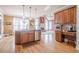 Kitchen with stainless steel dishwasher, island with sink and barstool seating, and natural light at 1765 Dew Pl, Marietta, GA 30064