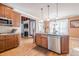 Modern kitchen with stainless steel appliances, island with sink, and hardwood floors at 1765 Dew Pl, Marietta, GA 30064