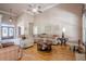 Open living room with lots of natural light, fireplace, beautiful chandelier, and hardwood floors at 1765 Dew Pl, Marietta, GA 30064