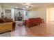 Living room featuring a wood-burning stove, stone wall, and durable laminate flooring at 1765 Dew Pl, Marietta, GA 30064