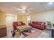 Living room with comfortable seating, a ceiling fan, and durable laminate flooring at 1765 Dew Pl, Marietta, GA 30064