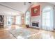 Open-concept living room with fireplace and abundant natural light at 1765 Dew Pl, Marietta, GA 30064