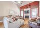 Inviting living room features a cozy fireplace, ample seating, and lots of natural light at 1765 Dew Pl, Marietta, GA 30064