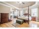 Spacious main bedroom with a four-poster bed and hardwood floors at 1765 Dew Pl, Marietta, GA 30064
