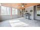 Enclosed sunroom with tile floor, windows all around and grill at 1765 Dew Pl, Marietta, GA 30064
