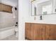 Bathroom featuring a modern vanity, neutral tile, and chrome fixtures at 3232 Abbeywood Dr, Decatur, GA 30034