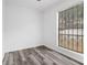 Clean bedroom with updated floors, a large window, and fresh white paint at 3232 Abbeywood Dr, Decatur, GA 30034