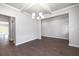Elegant dining room with hardwood floors and a chandelier at 113 Canal St, Hampton, GA 30228
