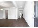 Inviting entryway featuring hardwood floors and an open floor plan at 113 Canal St, Hampton, GA 30228