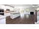 Modern open-concept kitchen with a center island, and stainless appliances at 113 Canal St, Hampton, GA 30228