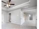 Spacious bedroom with a ceiling fan, carpet flooring, and neutral paint colors at 113 Canal St, Hampton, GA 30228