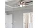 Spacious bedroom with a ceiling fan, carpet flooring, and neutral paint colors at 113 Canal St, Hampton, GA 30228