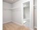 Spacious walk-in closet includes carpet floor and coated wire shelving for organized storage at 113 Canal St, Hampton, GA 30228
