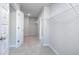 Well-organized walk-in closet with ample shelving and hanging space to keep belongings neatly stored at 113 Canal St, Hampton, GA 30228