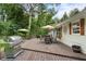 Back deck with grill, patio seating, table, and umbrellas provides a relaxing space at 2109 Allgood Rd, Marietta, GA 30062