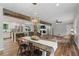 Open floor plan with dining area flowing into the kitchen and living room with hardwood floors at 2109 Allgood Rd, Marietta, GA 30062