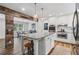 Bright kitchen with stainless steel appliances, granite countertops, and seamless flow to dining area at 2109 Allgood Rd, Marietta, GA 30062