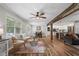 Bright living room with hardwood floors, rustic beam, and a view of the dining area and kitchen at 2109 Allgood Rd, Marietta, GA 30062