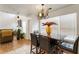Dining room with contemporary light fixture, table, and a view to the living area at 2833 Golden Club Bnd, Austell, GA 30106