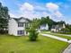 View of a two-story home from the side, with a well-maintained lawn at 2833 Golden Club Bnd, Austell, GA 30106