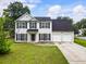 Charming two-story home featuring a two-car garage and a well-maintained lawn at 2833 Golden Club Bnd, Austell, GA 30106