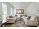 Spacious living room boasts white sofas, a decorative mirror, and a plush rug for a cozy and inviting atmosphere at 2833 Golden Club Bnd, Austell, GA 30106