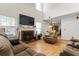 Spacious living room with a fireplace, high ceilings, and comfortable sofas creating an inviting atmosphere at 2833 Golden Club Bnd, Austell, GA 30106