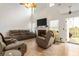 Bright living room with vaulted ceiling, hardwood floors, and fireplace at 2833 Golden Club Bnd, Austell, GA 30106