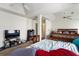 Spacious main bedroom featuring fan, carpeted floors, and large TV at 2833 Golden Club Bnd, Austell, GA 30106