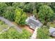 Aerial view of a house surrounded by mature trees, showcasing its secluded setting and spacious lot at 4920 Hampton Lake Dr, Marietta, GA 30068