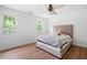 Comfortable bedroom with plush bedding, hardwood floors, and bright windows at 4920 Hampton Lake Dr, Marietta, GA 30068